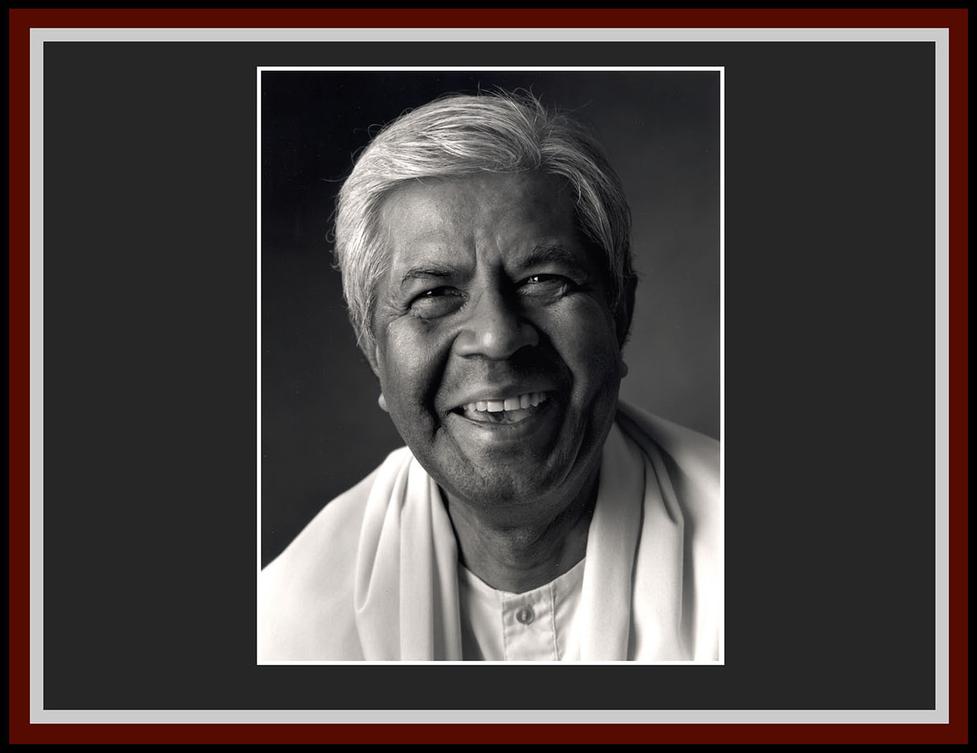 Swami Adiswarananda grinning.