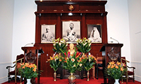 centered image of Altar to Sri Ramakrishna, Sri Sarada Devi, and Swami Vivekananda.