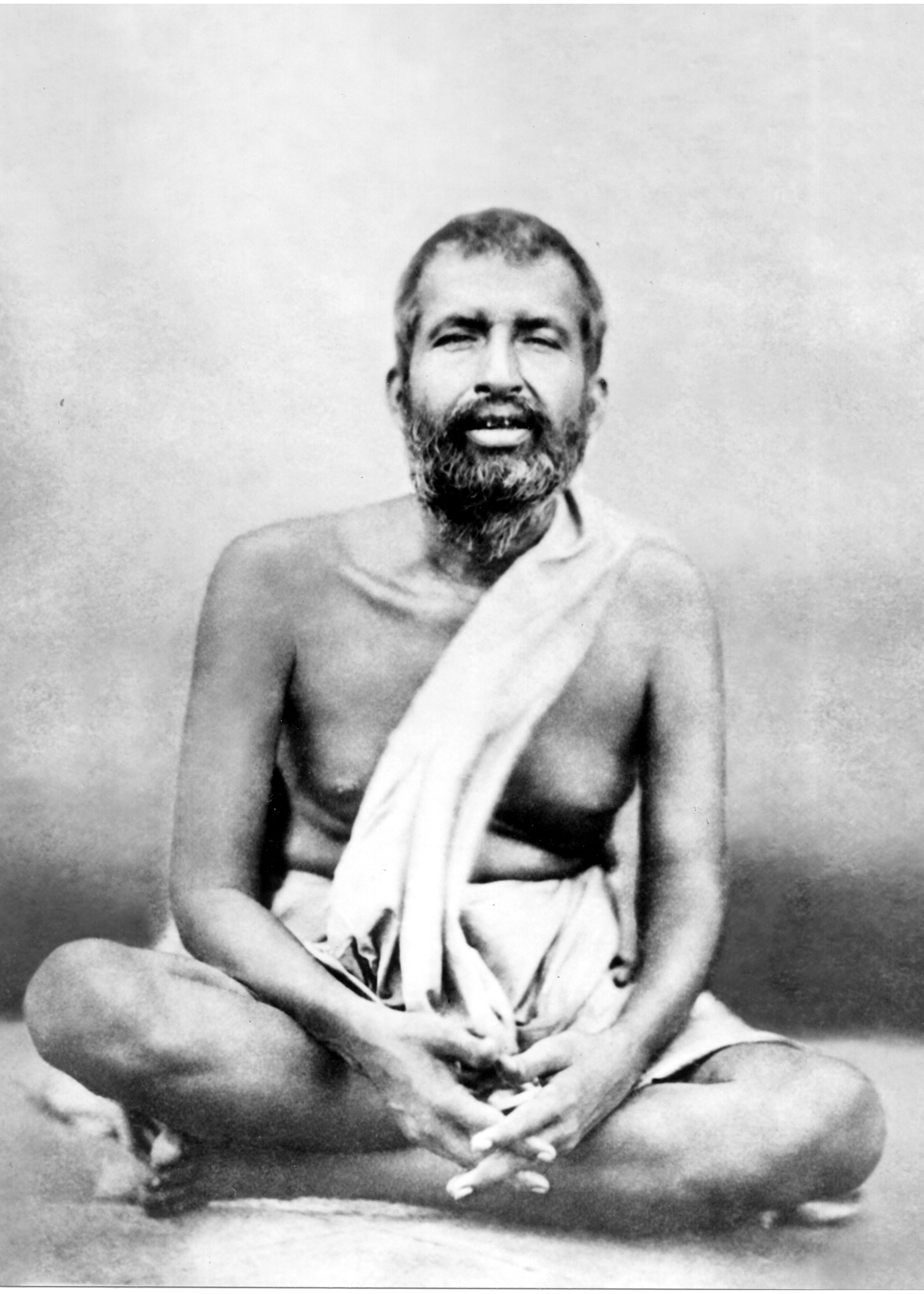 Black and white photo of Sri Ramakrisha seated.