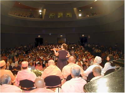 Nicole Leon Performing on Violin.